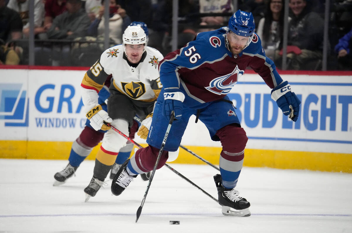 Colorado Avalanche defenseman Kurtis MacDermid (56) picks up the puck as Vegas Golden Knights c ...