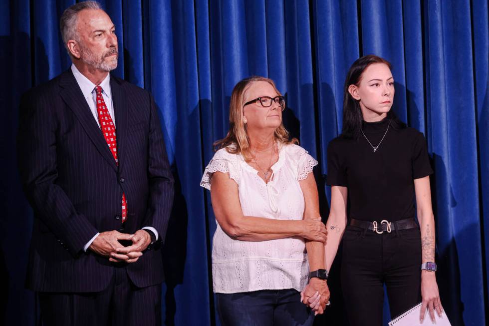 Clark County District Attorney Steve Wolfson, left, stands with Andreas Probst's widow, Crystal ...