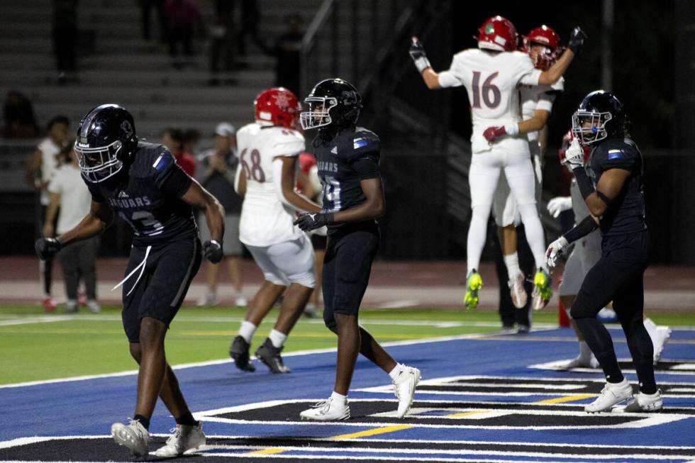 Desert Pines linebacker Semauri Norris-Johnson (13) walks away in frustration as against Arbor ...