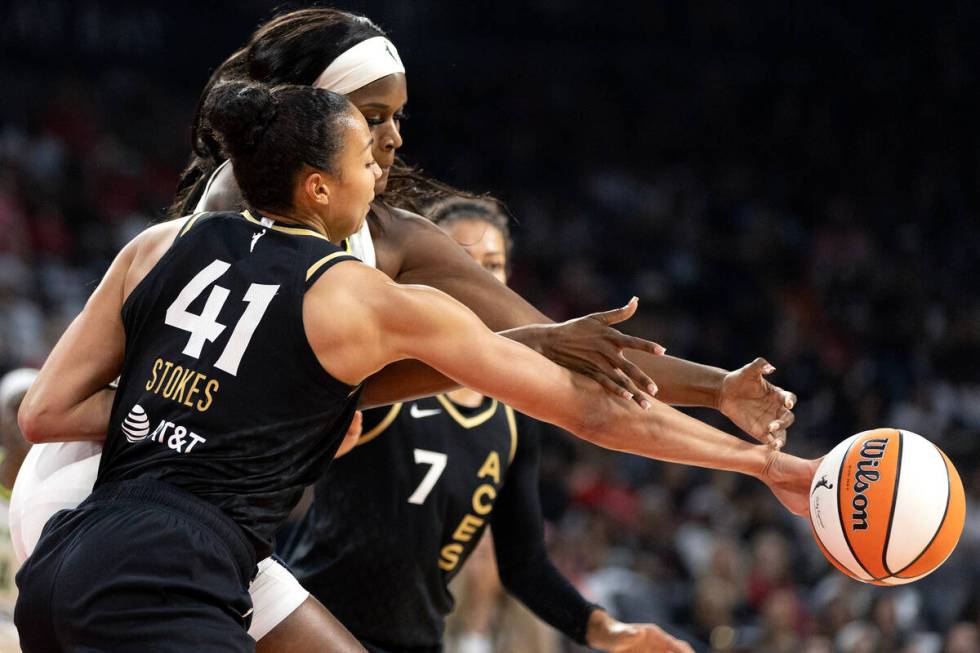 Las Vegas Aces center Kiah Stokes (41) steals the ball from Dallas Wings center Kalani Brown (2 ...