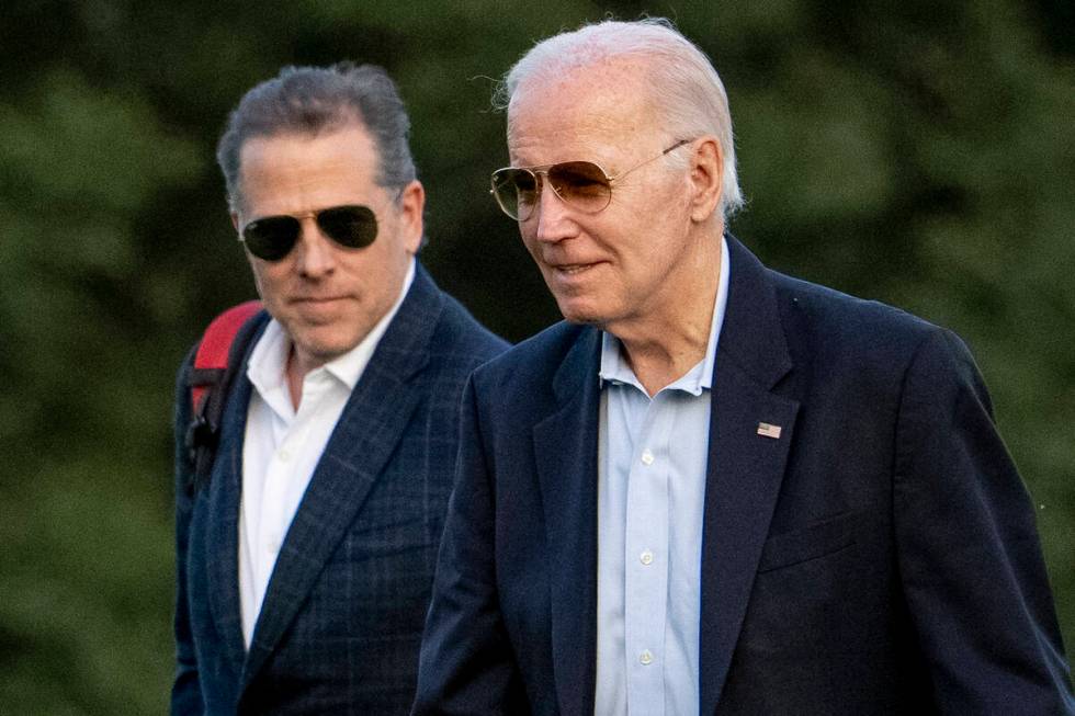 FILE - President Joe Biden, and his son Hunter Biden arrive at Fort McNair, Sunday, June 25, 20 ...