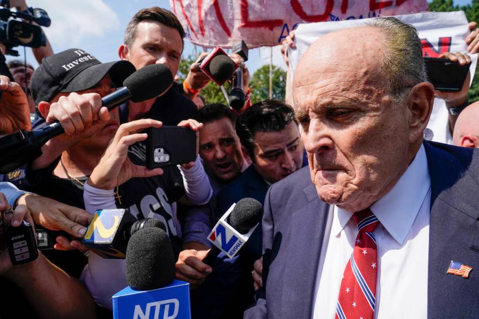 Rudy Giuliani speaks outside the Fulton County jail, Wednesday, Aug. 23, 2023, in Atlanta. Giul ...