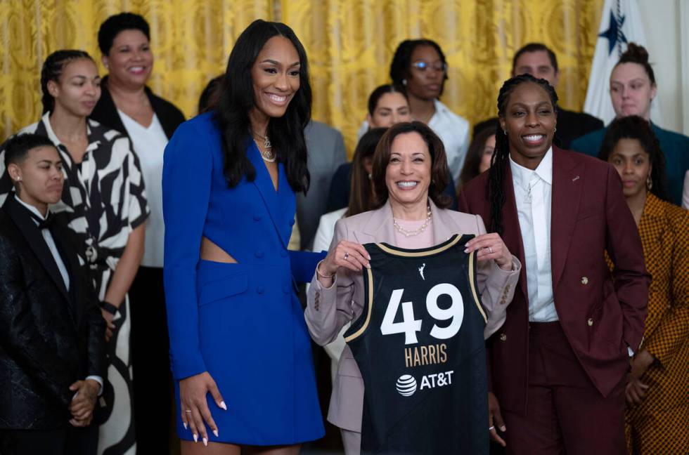 Vice President Kamala Harris is presented with a Las Vegas Aces jersey by Aces' A'ja Wilson, le ...