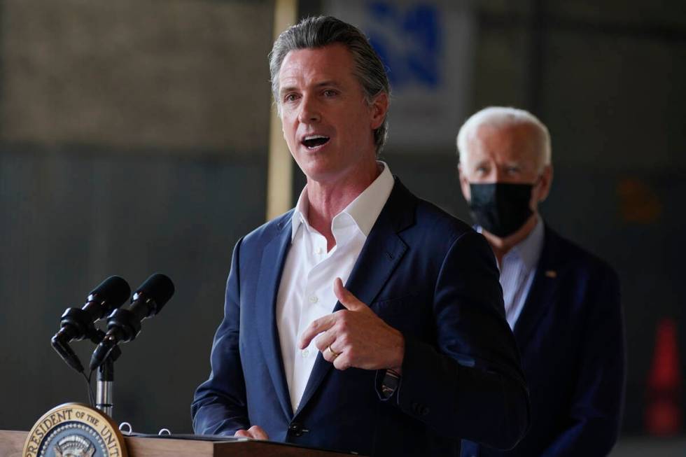 FILE - President Joe Biden listens as California Gov. Gavin Newsom speaks about recent wildfire ...