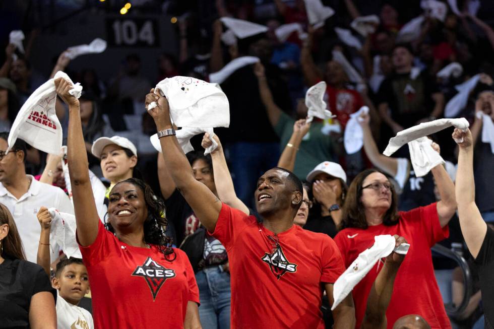 Las Vegas Aces fans wave their playoff towels during the first half in Game 2 of a WNBA basketb ...