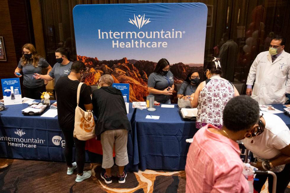 People visit the Intermountain Healthcare booth during the Aging Wellness Expo at Red Rock Reso ...