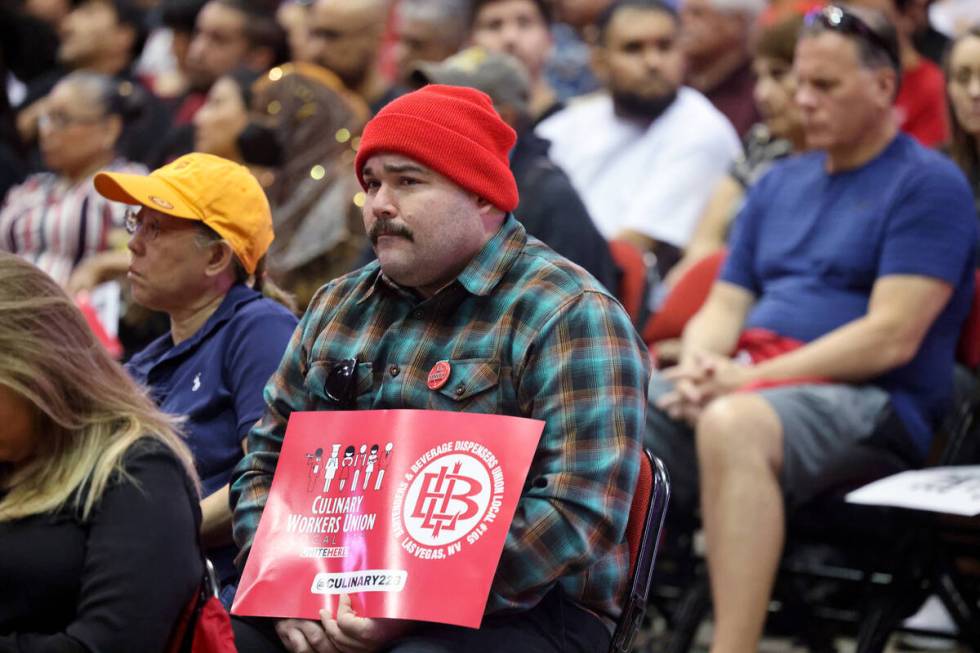 Culinary Union members, including Bellagio food server Michael Reyes, rally ahead of a strike v ...