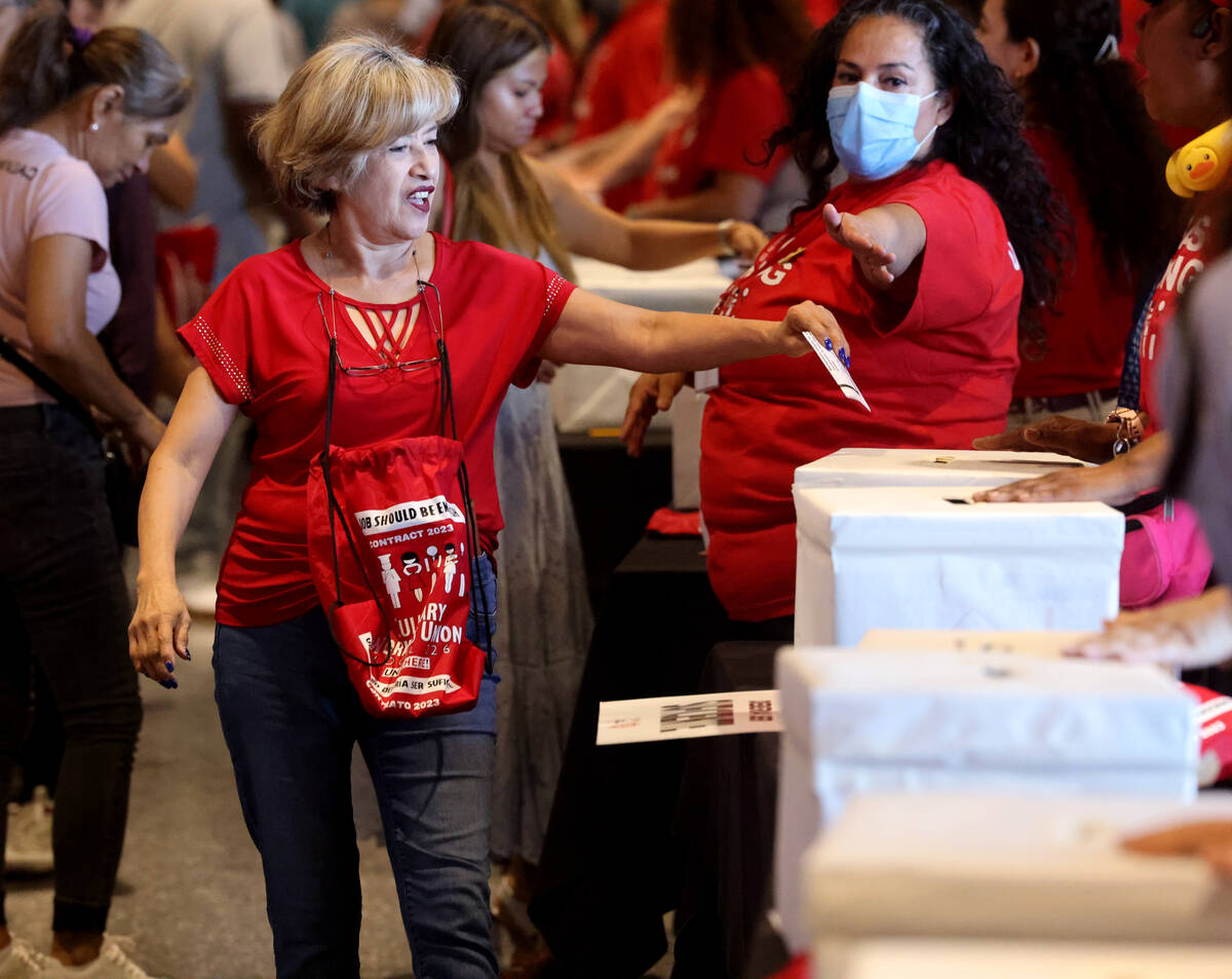 Culinary Union members, including Rio team member Elvira Bahena, cast their ballots during a st ...