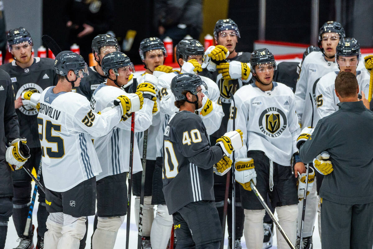 Golden Knights rookie defenseman Lukas Cormier (40) and forward Brendan Brisson (19) join teamm ...