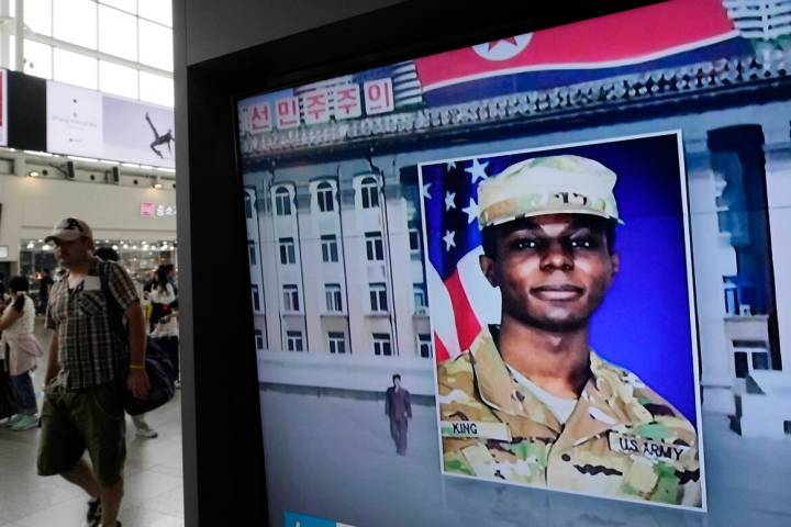 FILE - A TV screen shows a file image of American soldier Travis King during a news program at ...