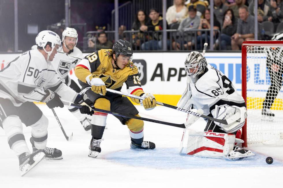 Golden Knights center Brendan Brisson (19) attempts a goal against Kings goaltender Jean-Franco ...