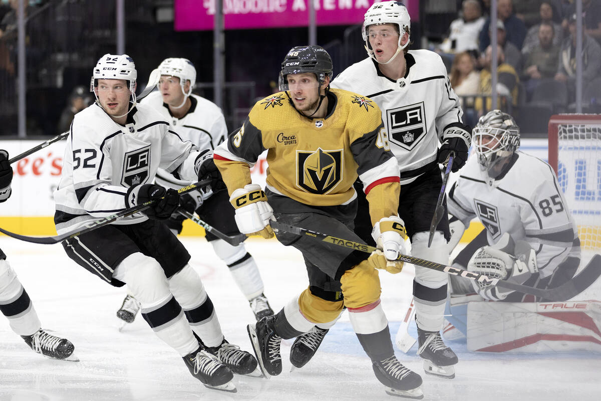 Golden Knights right wing Jonas Rondbjerg (46) anticipates the puck while surrounded by the Kin ...