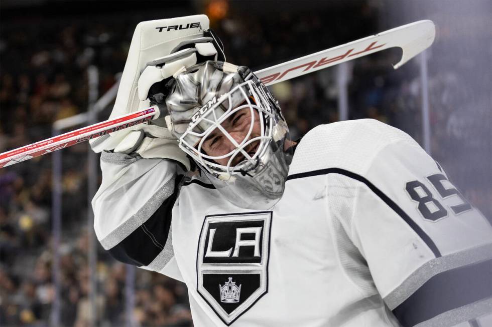 Kings goaltender Jean-Francois Berube (85) smiles while skating in between play during the thir ...