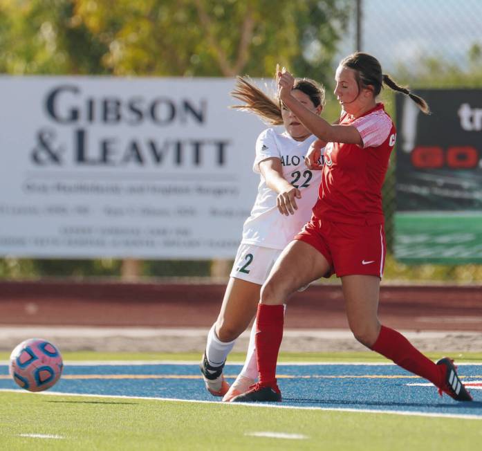 Coronado defensive player Liliana Schuth (3) fights to get to the ball with Palo Verde forward ...