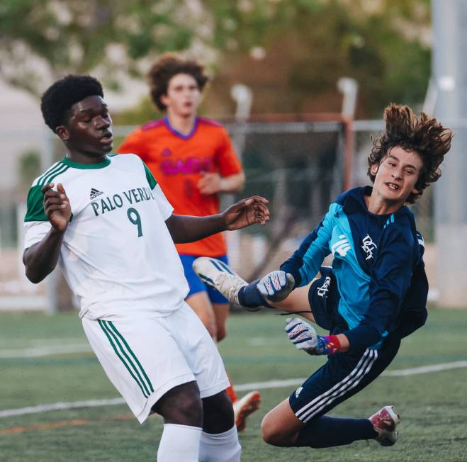 Bishop Gorman goalie Chase Cosenza (24) leaps to save the ball from the net during a game again ...