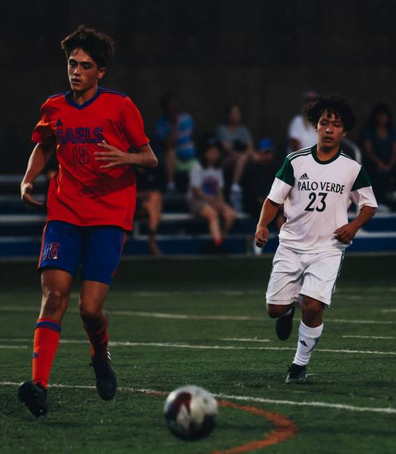 Bishop Gorman’s Massimiliano Musi (15) and Palo Verde forward Daniel Mercado (23) close ...