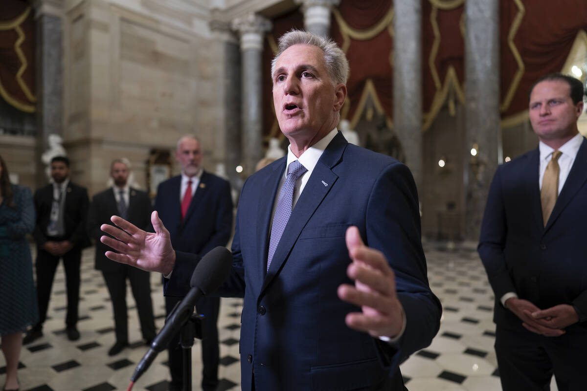 FILE - House Speaker Kevin McCarthy, R-Calif., joined by Rep. August Pfluger, R-Texas, right, a ...