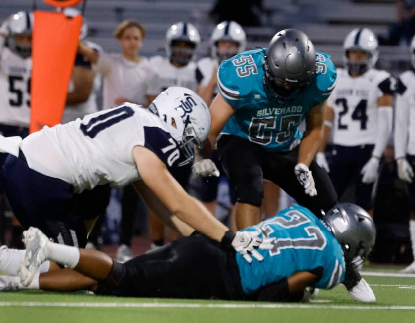 Shadow Ridge High Jackson King (70) tackles Silverado High Tau Epenisa (27) after Epenisa recov ...