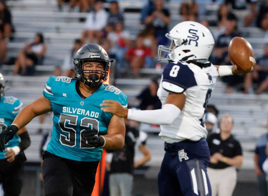 Shadow Ridge High quarterback Coen Coloma (8) throws a pass as Silverado High Jayland McGlothl ...