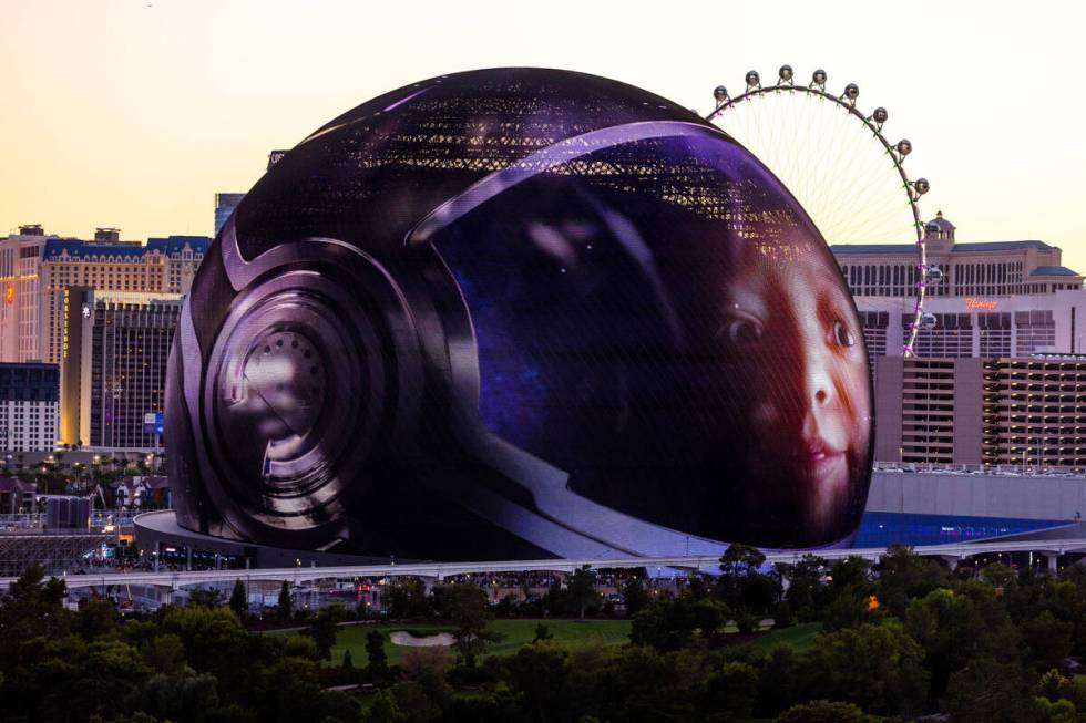 A child in a space helmet graphic during the opening night of the Sphere with U2 concert on sta ...