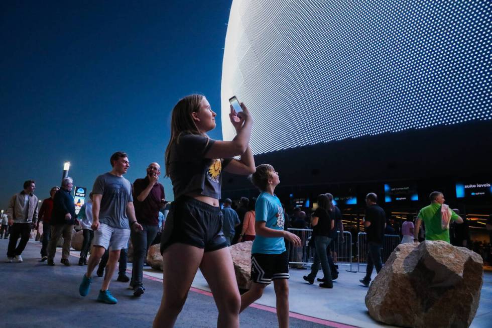 Excited fans wait outside of the Sphere on the night of its inaugural performance featuring U2 ...