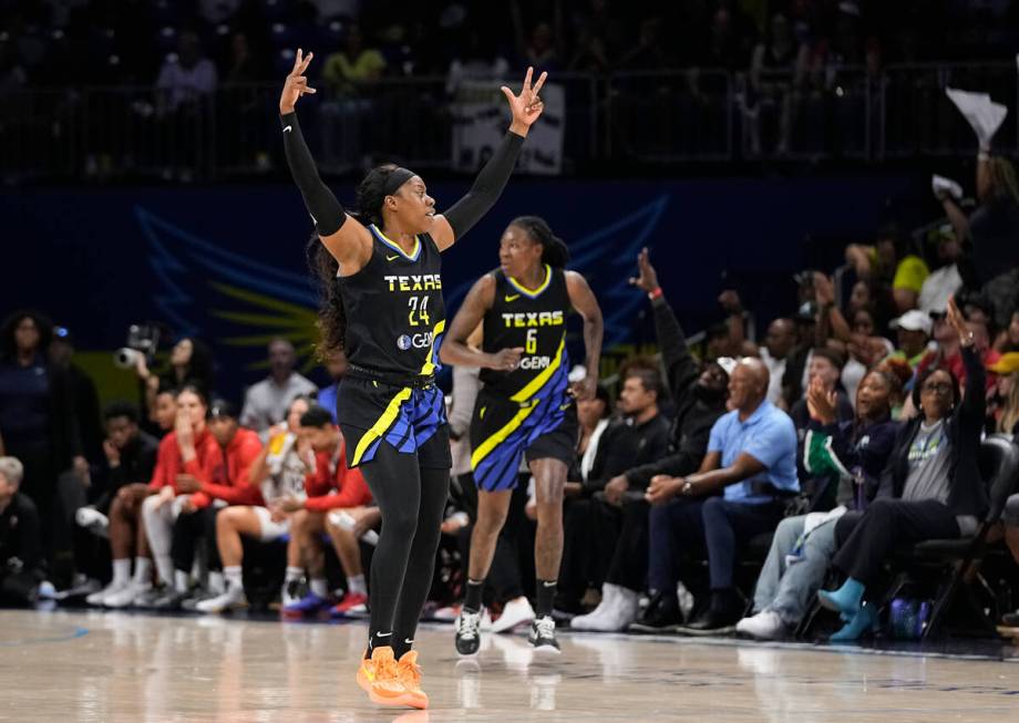 Dallas Wings guard Arike Ogunbowale (24) celebrates after forward Natasha Howard (6) made a 3-p ...