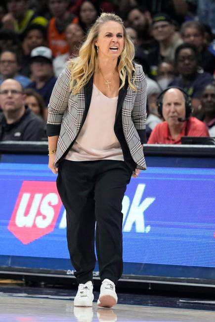 Las Vegas Aces head coach Becky Hammon gives instructions to the team during the second half of ...