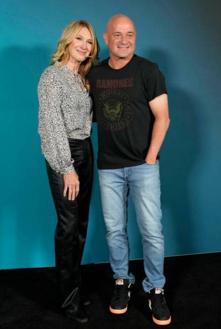 Former tennis stars Steffi Graf, left, and Andre Agassi pose during the opening night of the Sp ...