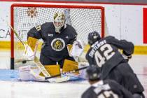 Golden Knights goalie Jiri Patera (30) deflects a shot attempt by forward Alex Swetlikoff (42) ...