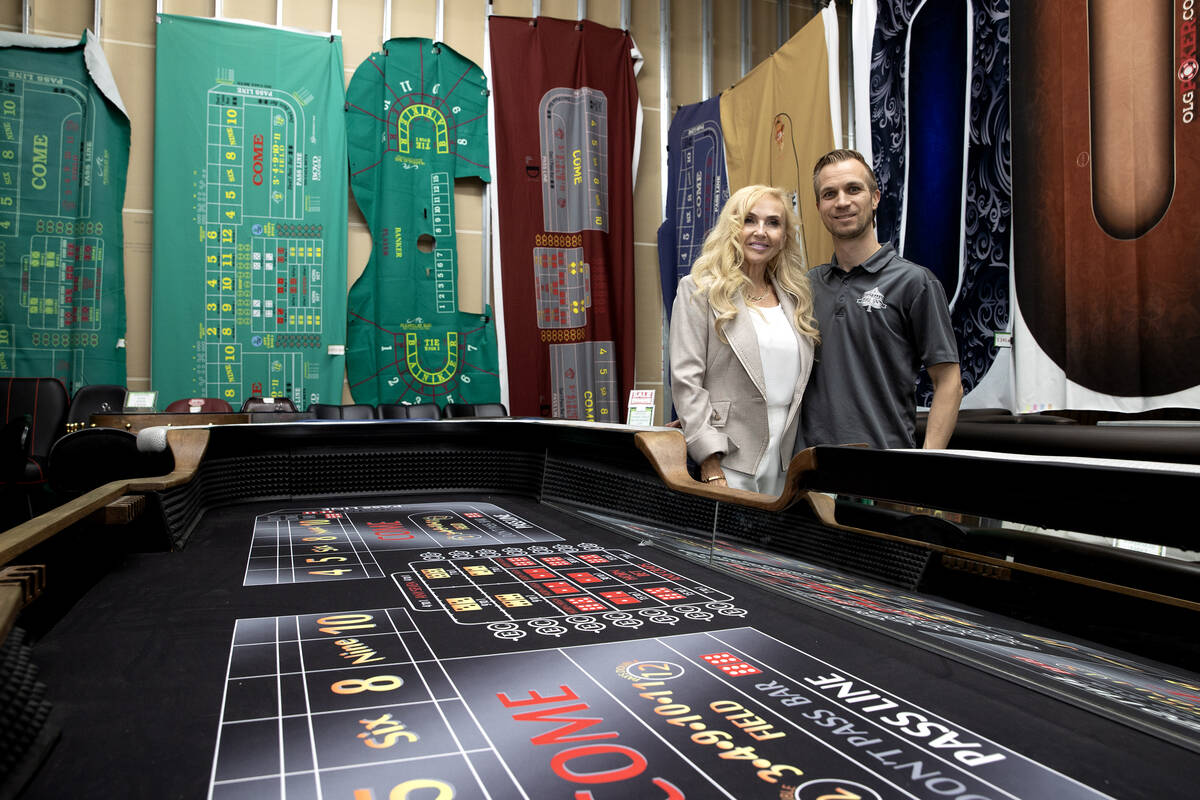 Co-owners Anne Spinetti, left, and Mikko Melander, stand for photos in a warehouse full of gami ...