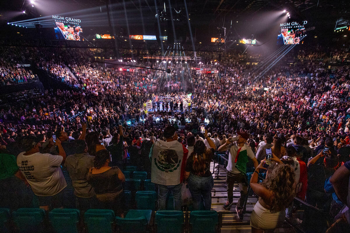 Saul "Canelo" Alvarez celebrates his win over Caleb Plant in the 11th round victory f ...