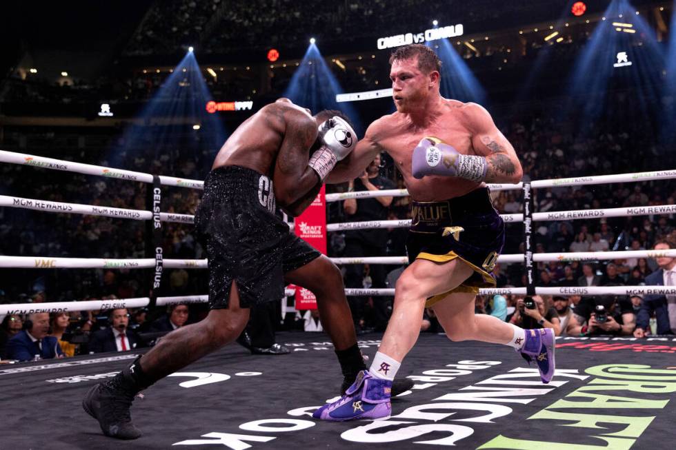 Canelo Alvarez hits Jermell Charlo during an undisputed world super middleweight title boxing b ...