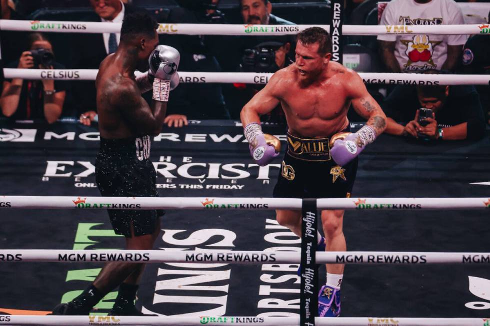 Canelo Alvarez and Jermell Charlo box during an undisputed world super middleweight title boxin ...