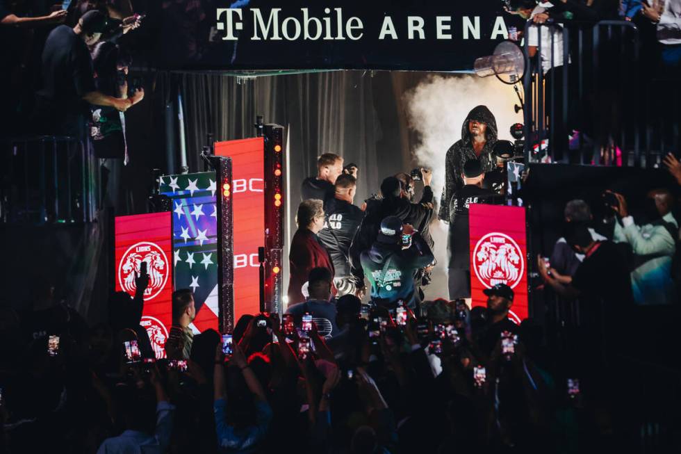 Jermell Charlo makes his grand entrance during an undisputed world super middleweight title box ...