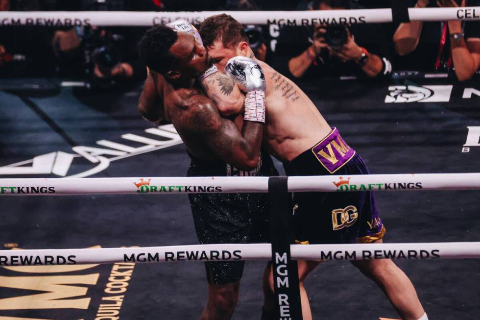 Canelo Alvarez and Jermell Charlo box during an undisputed world super middleweight title boxin ...