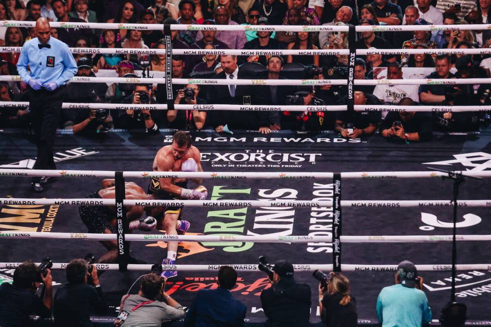 Canelo Alvarez punches Jermell Charlo during an undisputed world super middleweight title boxin ...