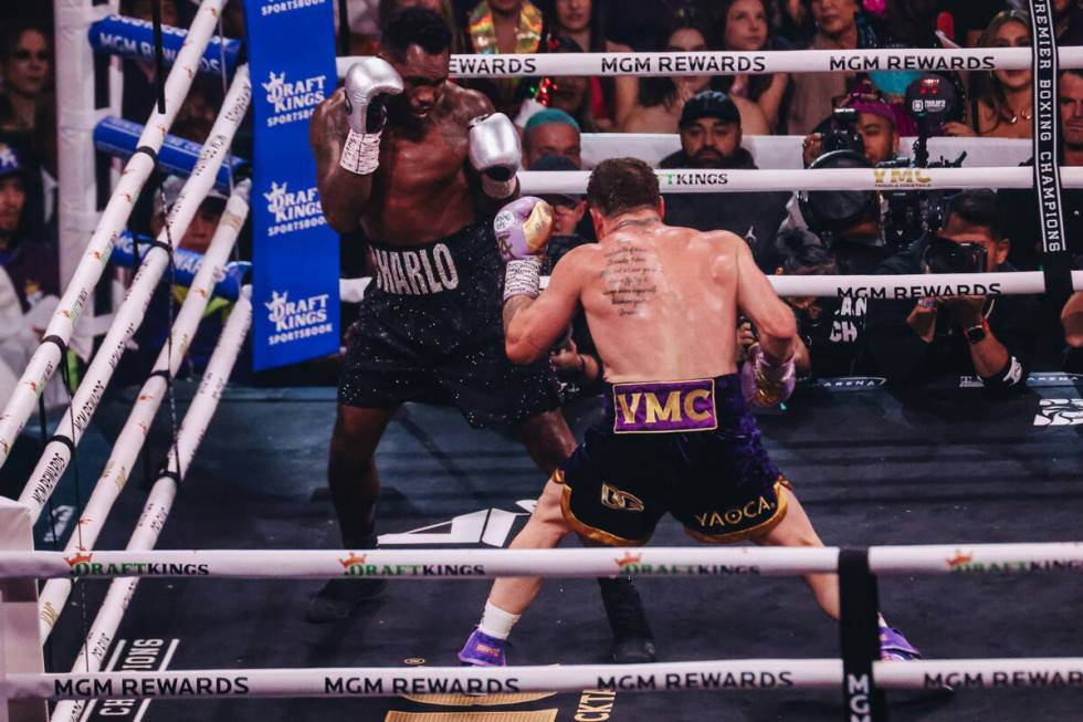 Canelo Alvarez and Jermell Charlo box during an undisputed world super middleweight title boxin ...