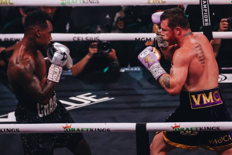 Canelo Alvarez and Jermell Charlo box during an undisputed world super middleweight title boxin ...