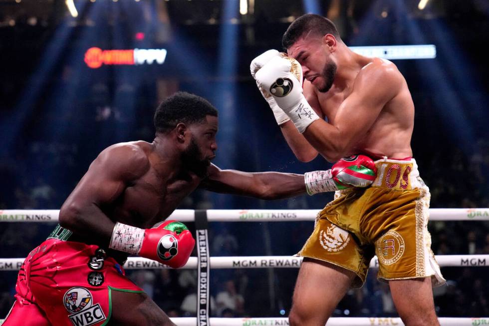 Jesus Ramos, right, takes a hit by Erickson Lubin in a super welterweight boxing match, Saturda ...