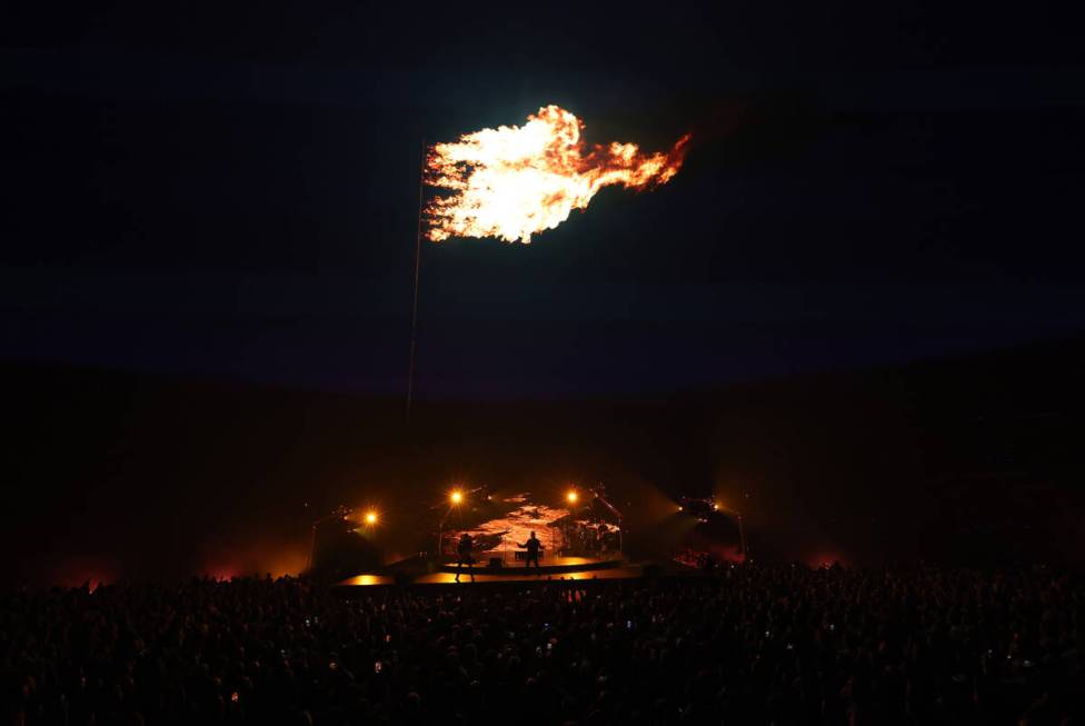 Bono, The Edge, Adam Clayton and Bram van den Berg of U2 perform during opening night of U2:UV ...