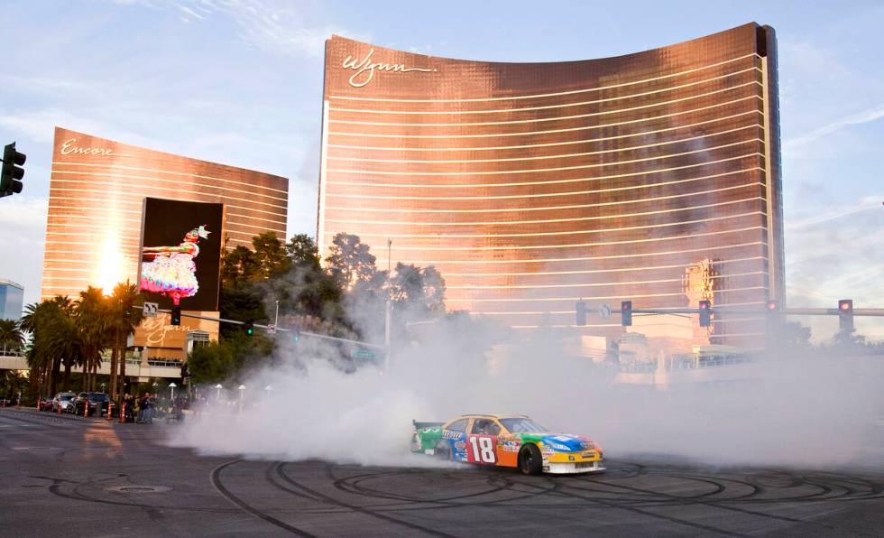 NASCAR Sprint Cup Series driver Kyle Busch performs a burnout in his number 18 M&Ms racing "sho ...