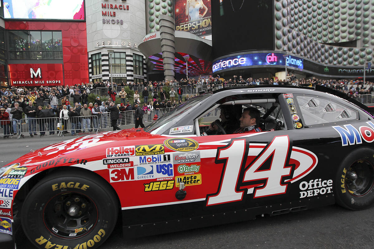 Driver Tony Stewart heads north on the Las Vegas Strip during NASCAR Champion's Week Victory La ...