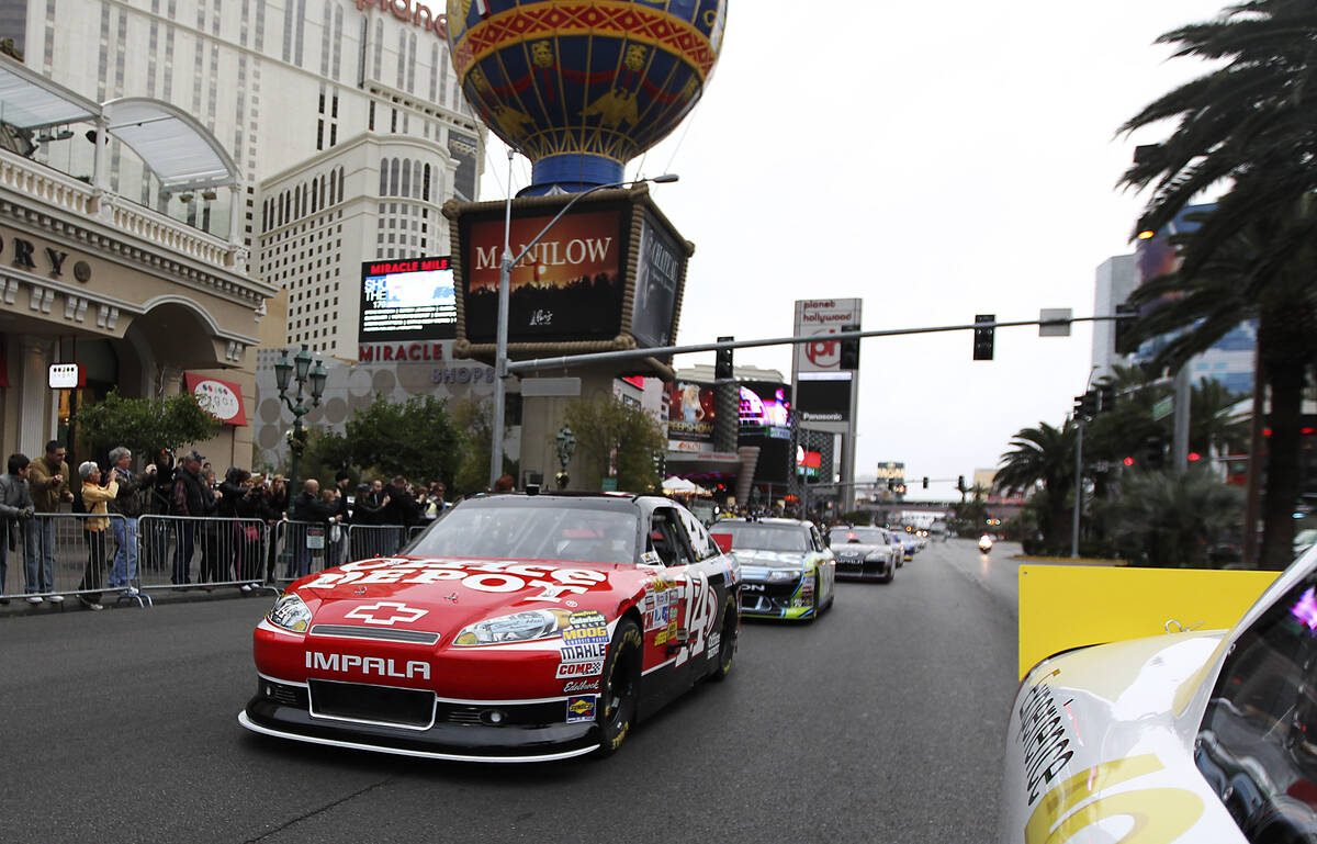 Tony Stewart leads the procession of race cars during NASCAR Champion's Week Victory Lap on the ...