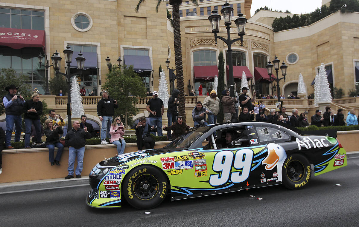 Driver Carl Edwards makes his way down the Las Vegas Strip during NASCAR Champion's Week Victor ...