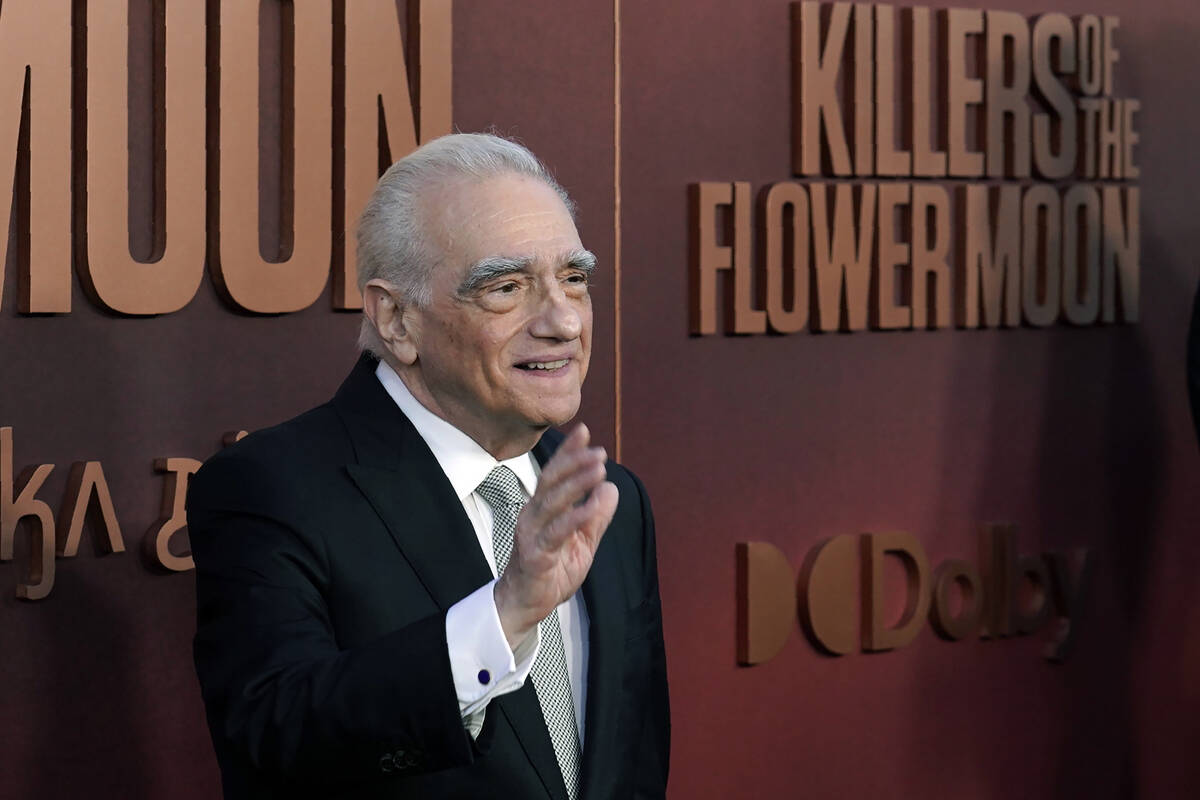 Martin Scorsese, director and co-writer of "Killers of the Flower Moon," waves at the ...