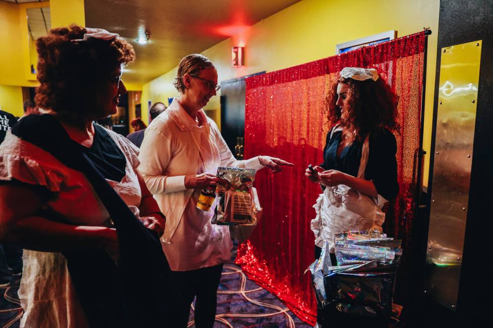 Patrons receive packets full of props for their interactive showing of “Rocky Horror Pic ...