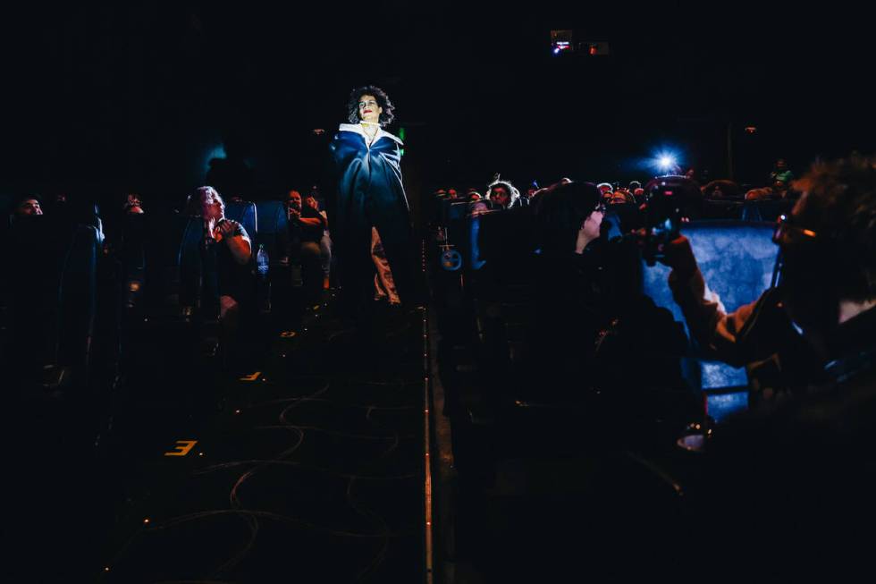 Frank-N-Furter walks down the theater aisle during a live action showing of “Rocky Horro ...