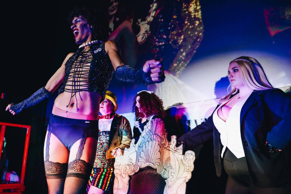 Frank-N-Furter, middle, sings “Sweet Transvestite” during a live action showing o ...