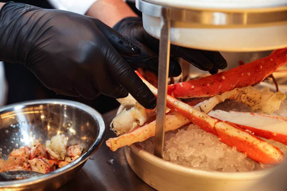 Executive Chef Eugenio Reyes puts together the Smoking Shellfish Tower at Ocean Prime, an upsca ...