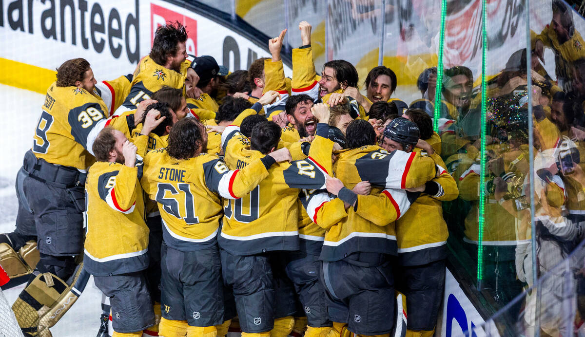 Golden Knights players come together in celebration after defeating the Florida Panthers 9-3 in ...